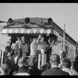 Lady Bird Johnson waving from back of train.