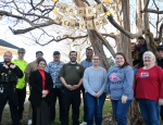 Town Hall and Police Department staff standing in front of tree