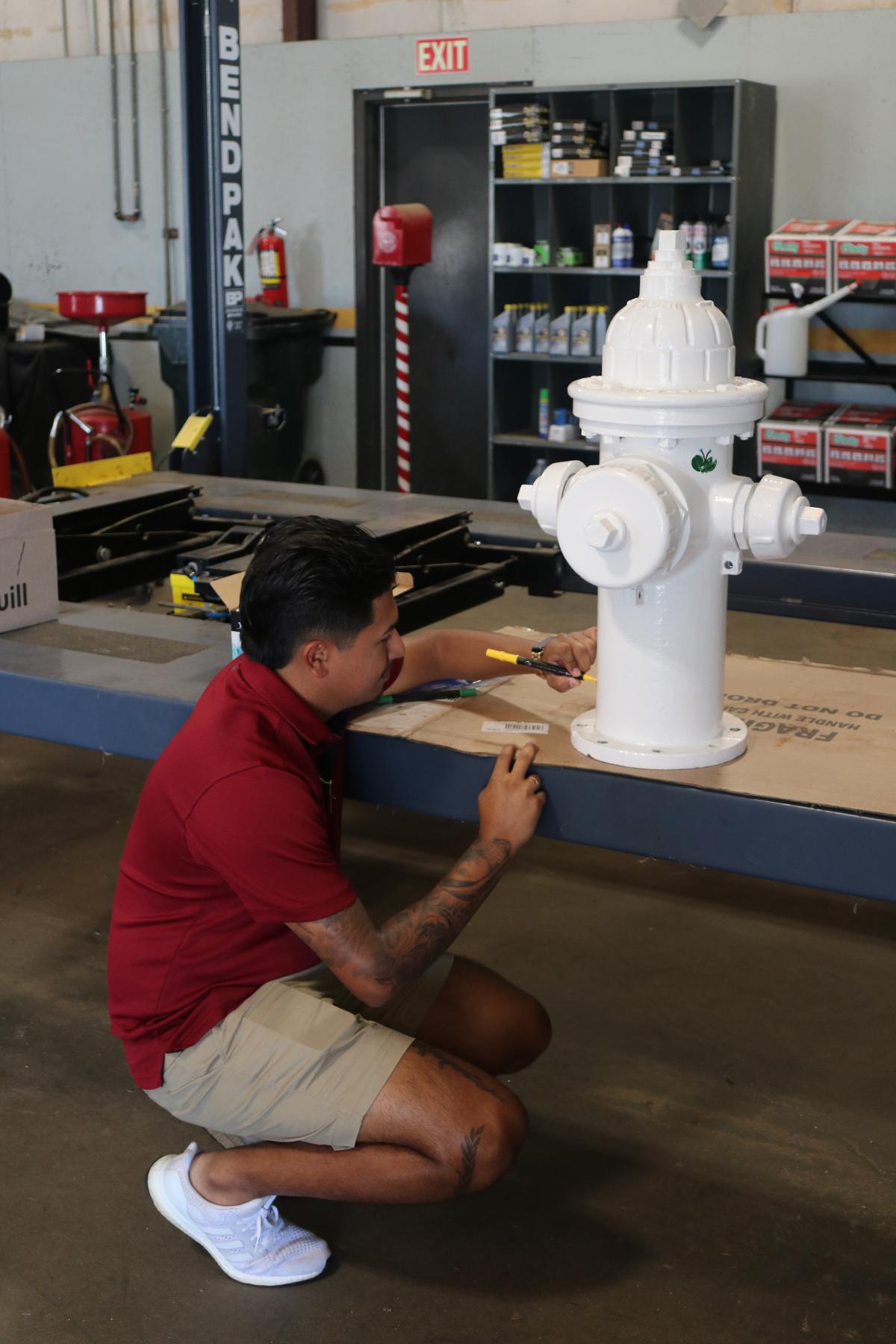 Kleber painting white fire hydrant