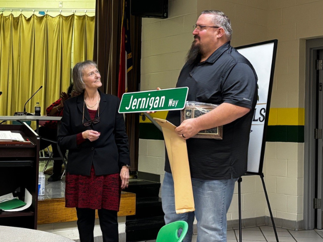 Mayor Fleta Byrd presenting street sign to Randy Jernigan