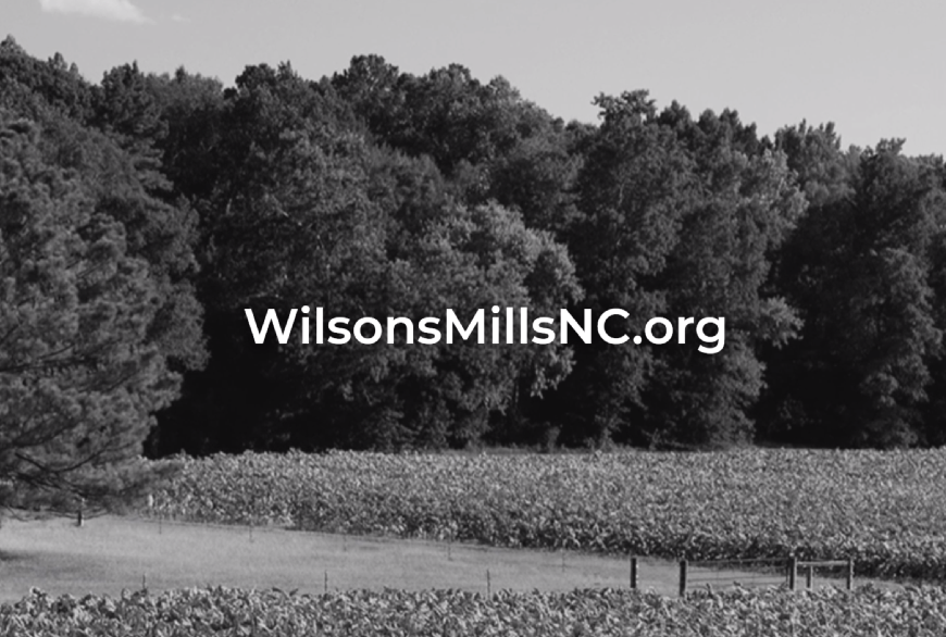 Black and white photo of field with website name overlayed